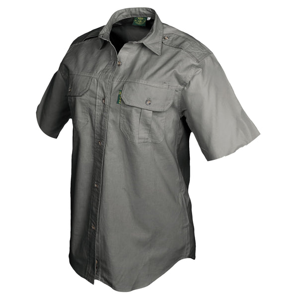 Side view of a Woman's Trail Shirt in Short Sleeves, color Olive. The shirt has two flap-covered chest pockets, functional cross-stitched shoulder straps, a button-front placket, double stitching throughout, and long rounded tails for tucking into pants. 100% cotton.