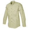 Side view of a Men's Shooter Shirt in Long Sleeves, color Stone. The shirt has a quilted shooting pad at the right shoulder, ammo pockets on the sleeves, two flap-covered chest pockets, button-down collars, functional cross-stitched shoulder straps, a button-front placket, double stitching throughout, and long rounded tails for tucking into pants. 100% cotton.